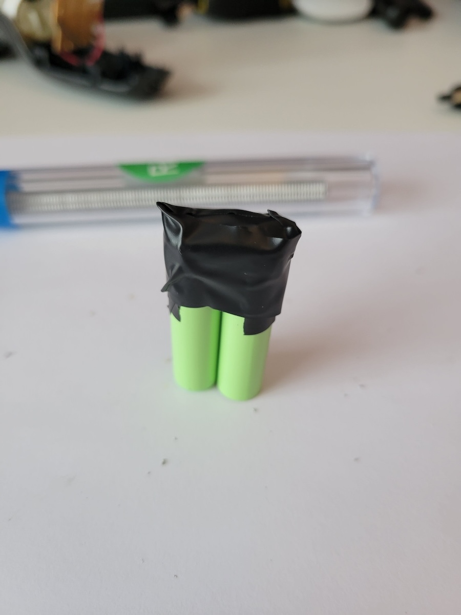 Two AAA batteries taped together